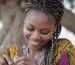 Woman with braided hair representing the traditional Chebe hair care practice in Chad